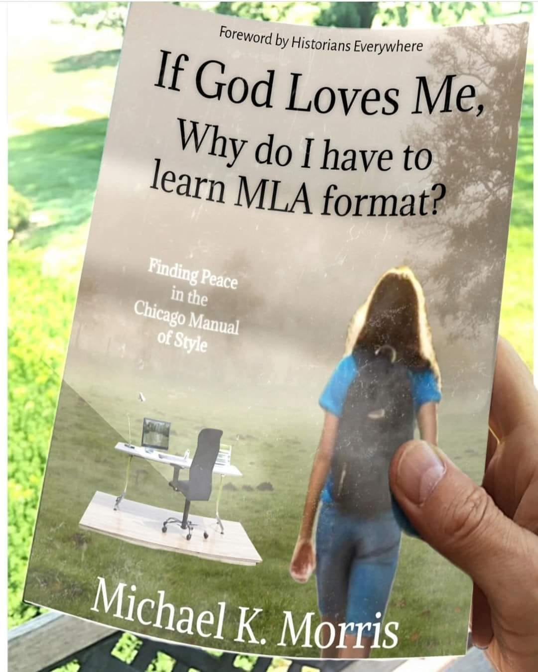 The meme is a play on the title of a book, "If God Loves Me, Why Do I Have to Learn MLA Format?" The image shows a person holding the book, with a picture of a person walking away from a desk with a computer and chair. The text on the book cover is in a font that is intentionally difficult to read, making it a humorous reference to the often-terrible font – or lack thereof – of many books.