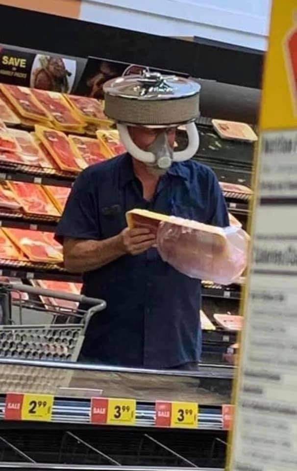 Here's an analysis of the image, structured with the requested headings. It's a rather unusual image, so some sections will be more developed than others. **Visual Description** The image shows a man shopping in what...