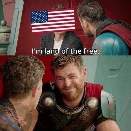 The meme is a humorous image of a character from the Marvel Cinematic Universe (Thor) with his eyes closed, implying he's not paying attention. The text "I'm not paying attention" is overlaid on the image. The character's friend, Thor, is standing behind him, and the friend is holding a sign with the American flag, but with the stars replaced by a skull. The text "I'm not paying attention" is likely a sarcastic comment on the friend's sign.