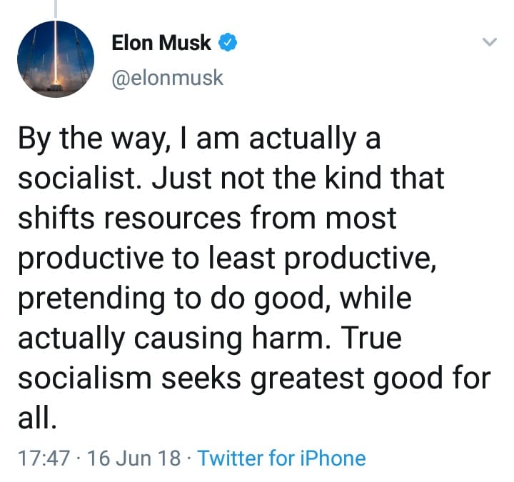 The meme is a screenshot of a tweet from Elon Musk, where he jokingly refers to himself as a "socialist" in a tongue-in-cheek manner, poking fun at the idea that he would ever be associated with the left-wing ideology. The text reads: "By the way, I am actually a socialist. Just not the kind that shifts resources from most productive to least productive, pretending to do good, while actually causing harm. True socialism seeks to create a world where everyone can have a good life."