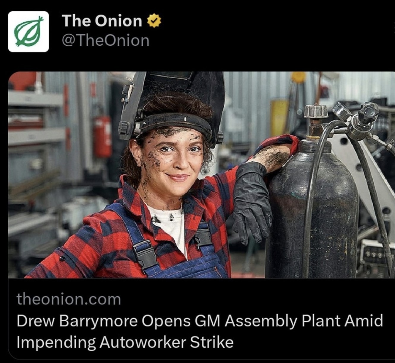 The meme is a screenshot of a news headline from "The Onion" with a photo of a woman in a factory or workshop, likely covered in dirt and grime. The headline reads: "Drew Barrymore Opens GM Factory, Immediately Closes It Due to Unforeseen Reason". The image is likely a humorous exaggeration of a news headline, implying that Drew Barrymore, a famous actress, has opened a factory that she immediately shuts down, implying that it was always doomed to fail.