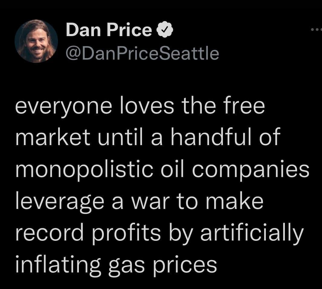 This meme is a humorous take on the concept of "free market" capitalism. The image shows a picture of a man with a shocked expression, with the caption "When you realize the 'free market' is just a euphemism for 'we're all just pawns in a game of economic imperialism'".