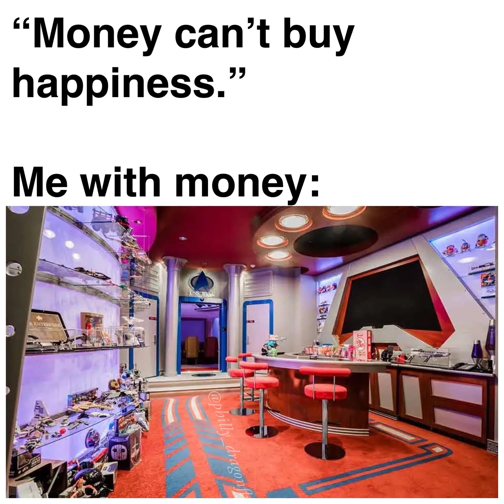 The meme is a humorous take on the phrase "money can't buy happiness." It features a picture of a luxurious, high-tech room filled with expensive gadgets and toys. The text at the top reads "Money can't buy happiness" and the text below it says "But it can buy a room like this".