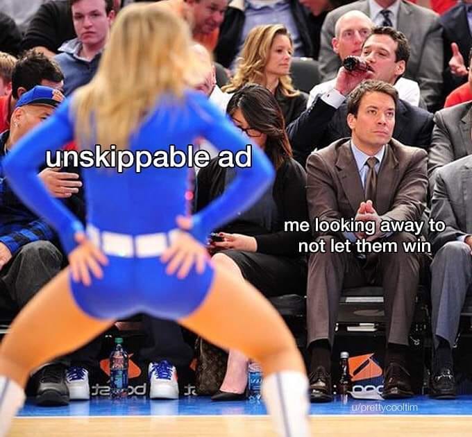 This meme features a screenshot of a sports commentator's reaction to a commercial break. The image shows the commentator with a shocked expression, and the text "unskippable ad" is overlaid on the screen. The meme is captioned "when you're trying to watch the game but the ad is unskippable".