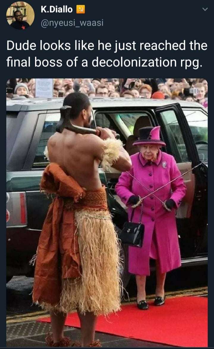 This meme is a humorous image of a person dressed in a ridiculous, elaborate costume, standing next to Queen Elizabeth II, who is also dressed in a more formal outfit. The image is captioned "Dude looks like he just raided the last village" and "Dude looks like he just raided the last village", implying that the person is dressed in a fantasy RPG-inspired outfit, while the queen is not. The meme is likely poking fun at the idea that the person's outfit is so outlandish that it's like they just raided a village.
