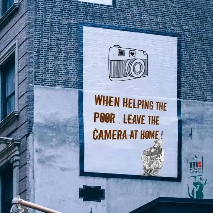 This meme is a play on the classic "don't shoot" warning sign, but with a humorous twist. The image shows a sign with a camera and the text "When helping the poor, leave the camera at home".