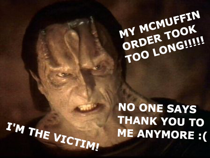 This meme is an image of the character Garth from the TV show "Star Trek: Deep Space Nine". The text "I'm the victim" is written on Garth's chest, with his mouth open in a scream. The text "I'm the victim" is a humorous reference to a scene from the show where Garth is actually the victim of a plot to kill him, and he is screaming because he is being attacked.
