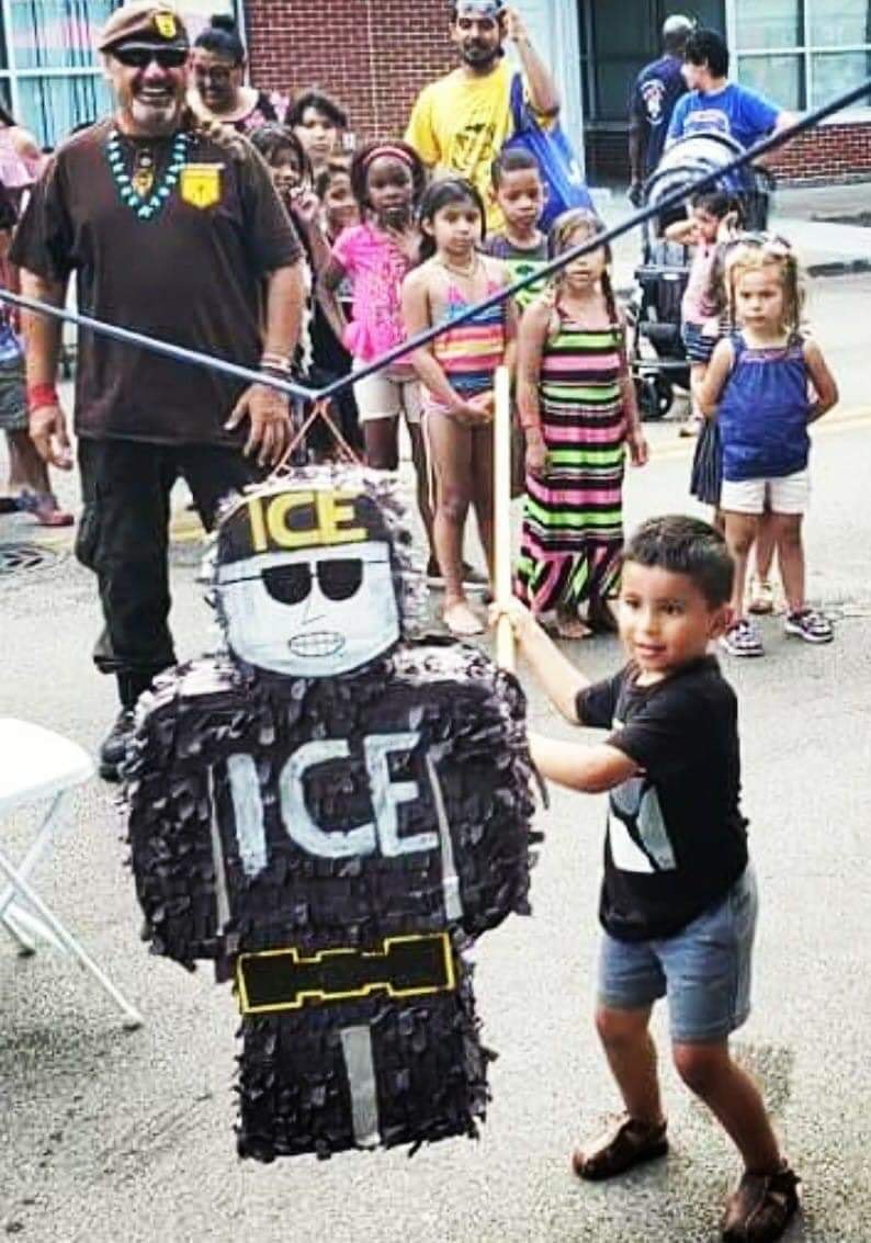The meme is a picture of a young boy holding a piñata shaped like the character from the movie "Ice Cube" (not the rapper). The text "ICE" is written on the piñata, and the boy is holding a bat to break it open. The meme is likely referencing the controversy surrounding the Trump administration's "zero-tolerance" immigration policy and the use of the term "ICE" as a symbol of oppression.