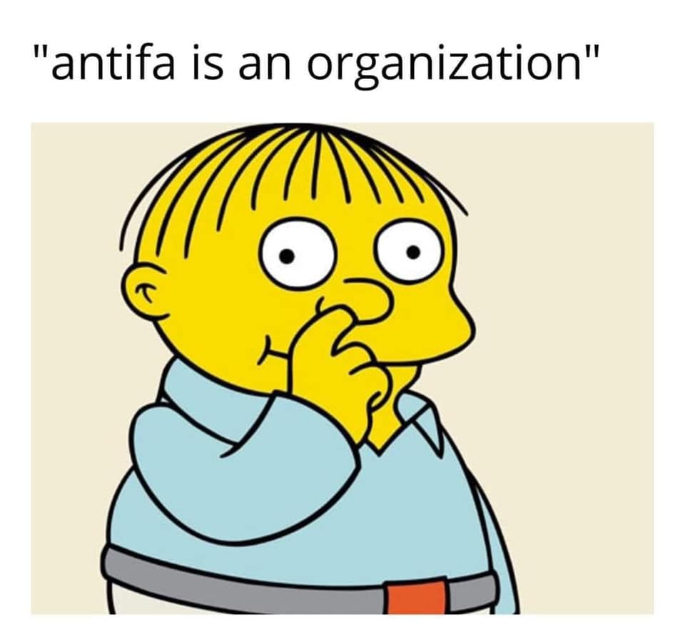 This meme features a screenshot from the animated TV show "The Simpsons" with character Ralph Wiggum looking confused. The text above the image reads "I didn't know that" and the text below the image says "antifa is a left-wing activist group that has been accused of being a terrorist organization by some politicians and media outlets, but its supporters say it's a legitimate organization that fights against fascism and racism." The meme is likely poking fun at the idea that some people may not know what "antifa" is or what it represents, despite it being a well-known and widely discussed topic in recent years.