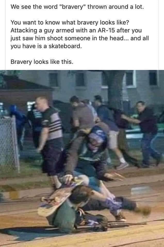 The meme is a satirical commentary on the word "bravery" and its interpretation. It features an image of a man being shot in the head by an AR-15 and using a skateboard as a makeshift shield. The text above the image says, "You want to know what bravery looks like? Attacking a guy with an AR-15 after he just shot someone in the head... and all you have is a skateboard." The text concludes, "Bravery looks like this."