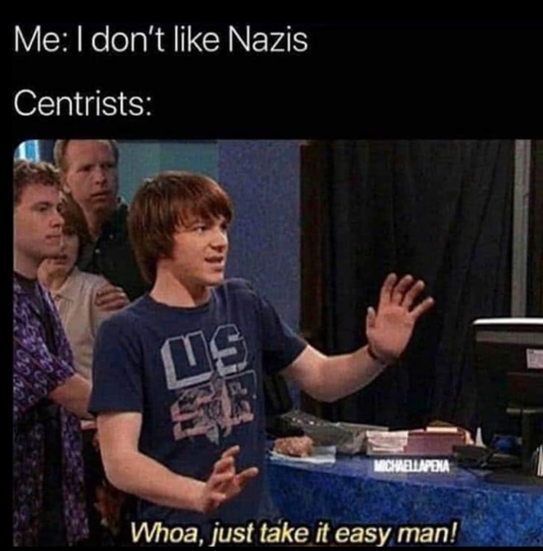 The meme is a humorous comparison between two groups of people. The top text reads "Me: I don't like Nazis" and "Centrists:", implying that the speaker is not a fan of the extreme right. The image is of a young boy from the TV show "The Goldstein" who is enthusiastically saying "Whoa, just take it easy man!" in response to someone else's statement. The meme is poking fun at the idea that people who are not extreme right or left are often seen as "centrists" and are often criticized for being "not really anything".