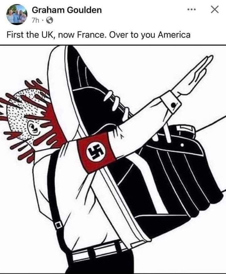 This meme is a satirical illustration of a person with a swastika on their arm, giving a Nazi-style salute, with their head exploding into blood. The image is accompanied by the text "First the UK, now France. Over to you America." The meme is likely a commentary on the rise of far-right and neo-Nazi groups in Europe and the potential for these groups to spread to other countries.