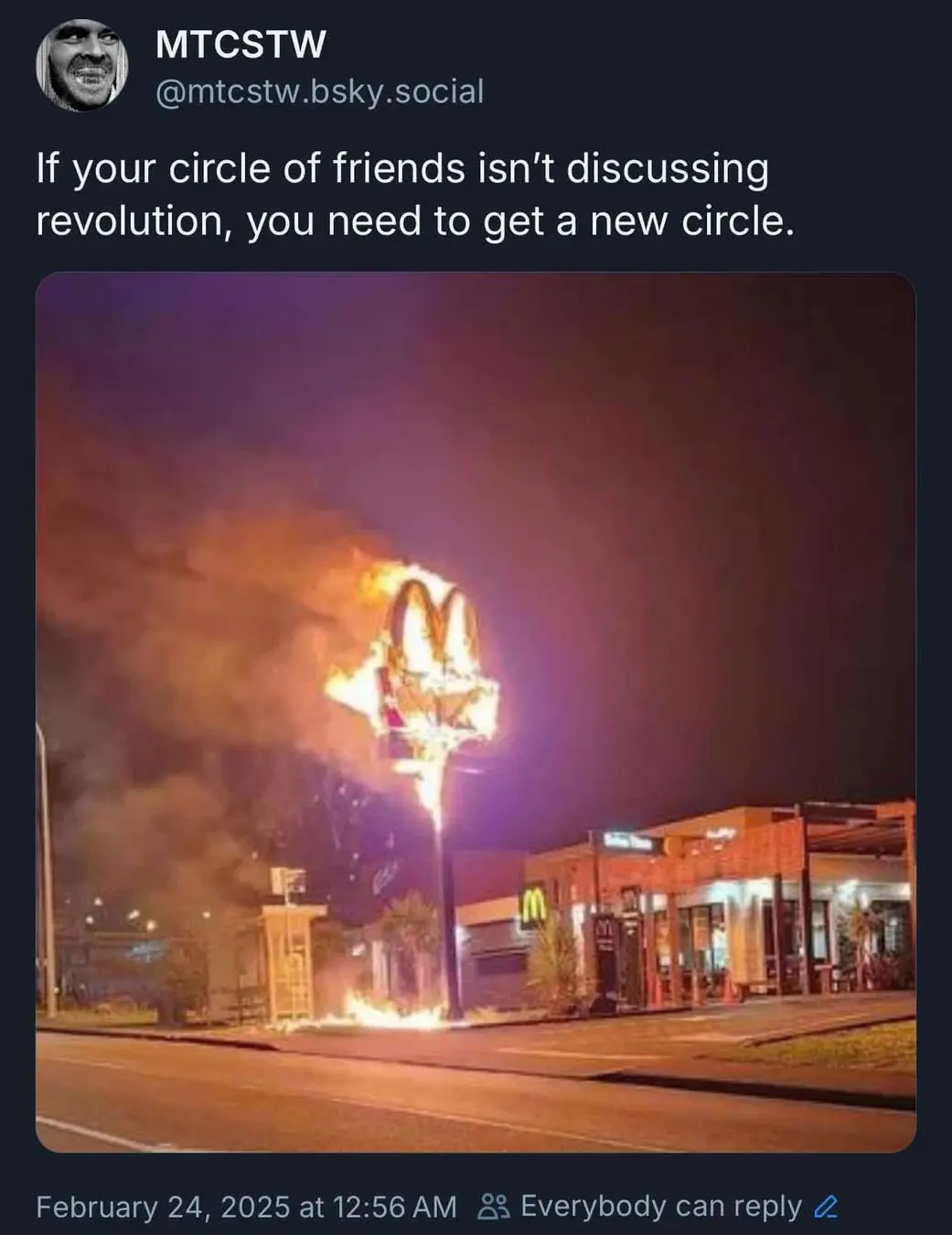The meme is a satirical commentary on the current state of social media and online discourse. The image depicts a chaotic and destructive scene, with a McDonald's restaurant engulfed in flames, and a sign reading "Fas...