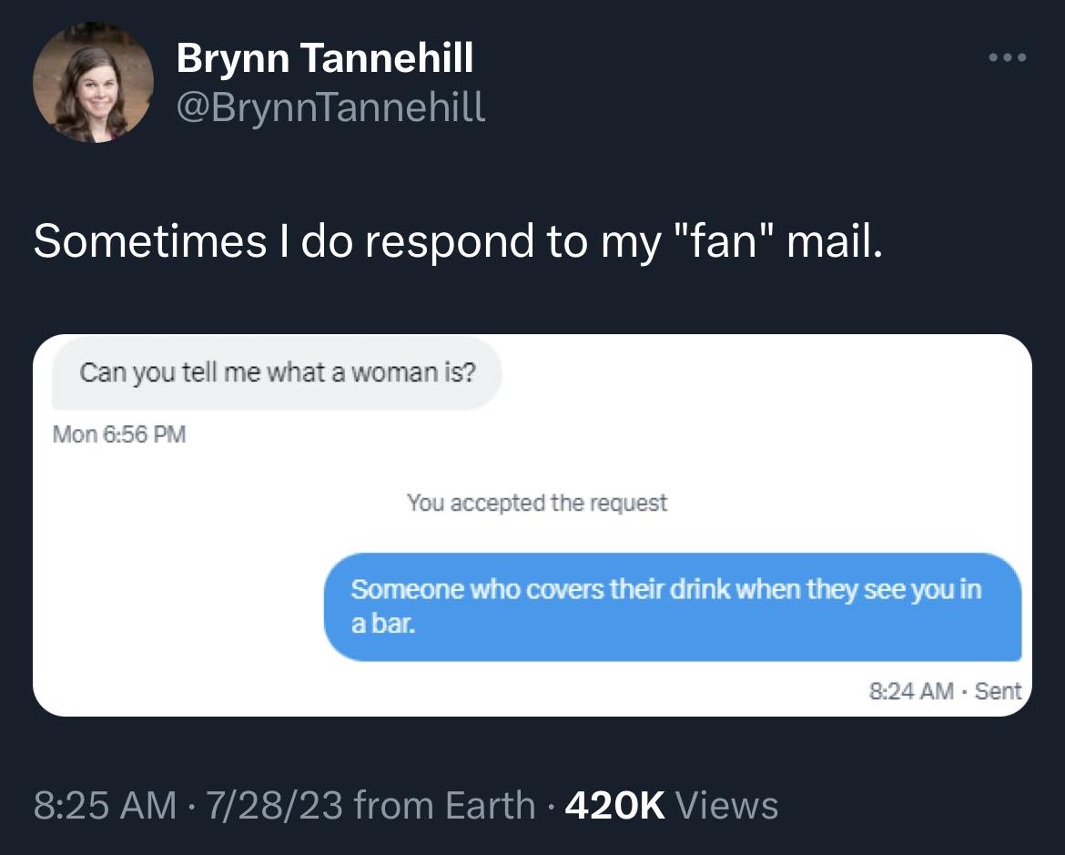 The meme is a screenshot of a Twitter conversation where someone asks a question about what a woman is, and the response is a joke about someone who covers their drink when they see someone in a bar. The text in the image reads: "Can you tell me what a woman is?" and the response is "Someone who covers their drink when they see you in a bar."