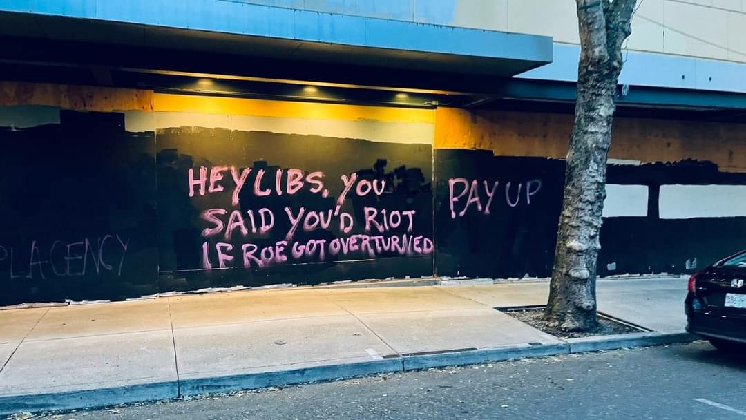 The meme is a humorous image of a person (known as "liberals" or "libs") who is upset or angry, but is being told to calm down or stop being so emotional. The text on the image says "Hey libs, you said you'd riot if Roe got overturned. It's been overturned. Now what?" The meme is poking fun at the idea that some people threatened to riot or be upset if a certain event (in this case, the overturning of the Roe v. Wade abortion rights decision) happened, but are now not following through on that threat.