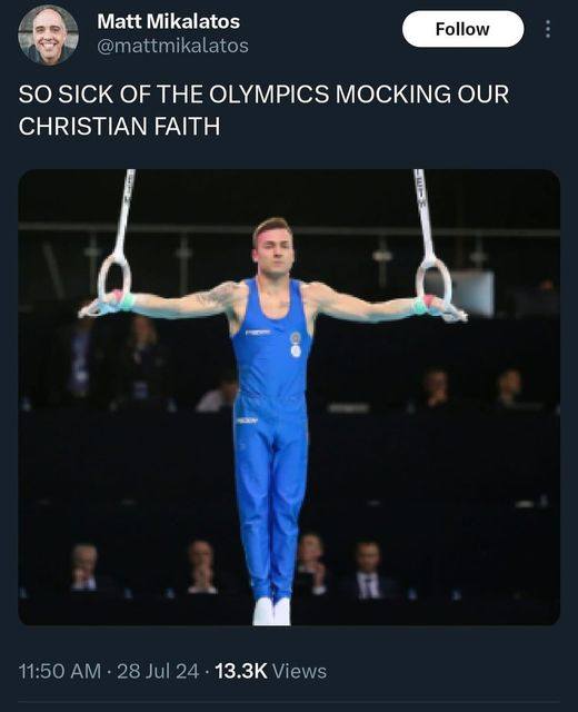 The meme features a photo of a gymnast performing on the rings, with his arms outstretched and his body in a stretched position. The image is accompanied by the text "SO SICK OF THE OLYMPICS MOCKING OUR CHRISTIAN FAITH". The meme is likely making a joke about the Olympics being too secular and not acknowledging the Christian faith, with the gymnast's pose being a humorous representation of the Olympics' lack of Christianity.