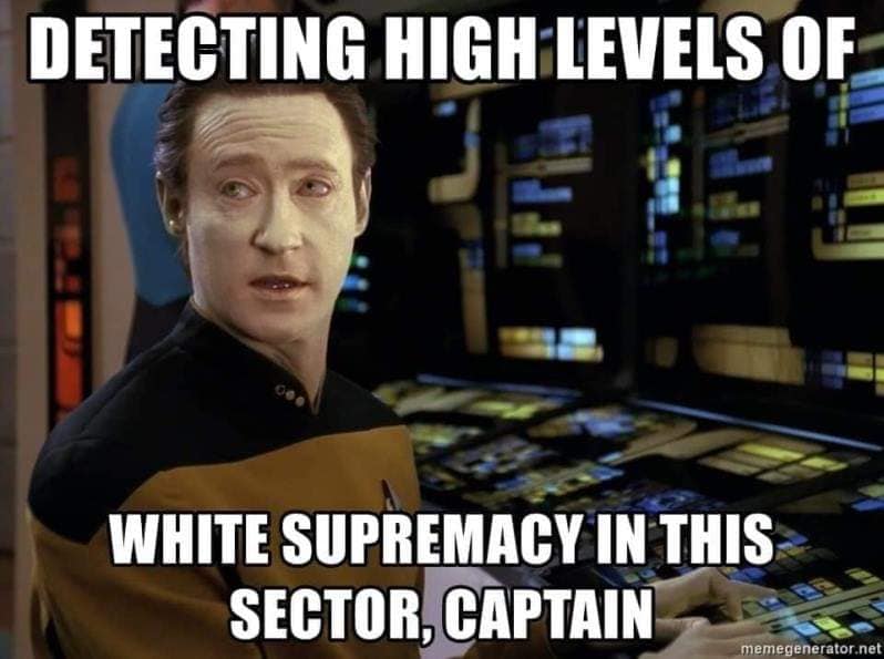 This meme features a still image of Jean-Luc Picard from the Star Trek: The Next Generation series, looking shocked and concerned. The text above the image reads "Detecting high levels of..." and below the image reads "White supremacy in this sector, Captain." The image is a humorous take on the idea that a character in a sci-fi show would be detecting something that is actually a social issue, rather than a space-related threat.