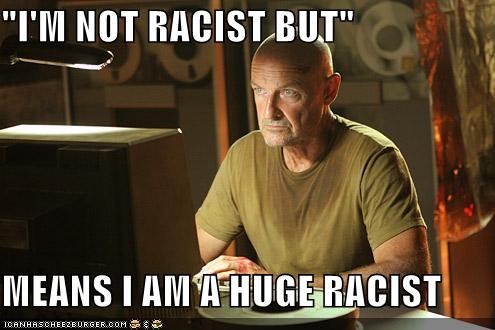 This meme is a photo of a character from the TV show "Breaking Bad" (played by Bryan Cranston) with a caption that reads: "I'm not racist, but... 'I'm not racist, but... I mean, I'm not racist, but...'" The meme is a humorous take on the idea that someone is trying to justify or downplay their racist behavior, using a tongue-in-cheek phrase to do so.