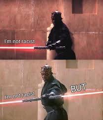 The meme is a split-screen image featuring a character from the Star Wars franchise, Darth Maul, wielding a red lightsaber. The top image reads "I'm not racist" and the bottom image reads "I'm not racist" with a red lightsaber in between, implying a connection to the phrase.