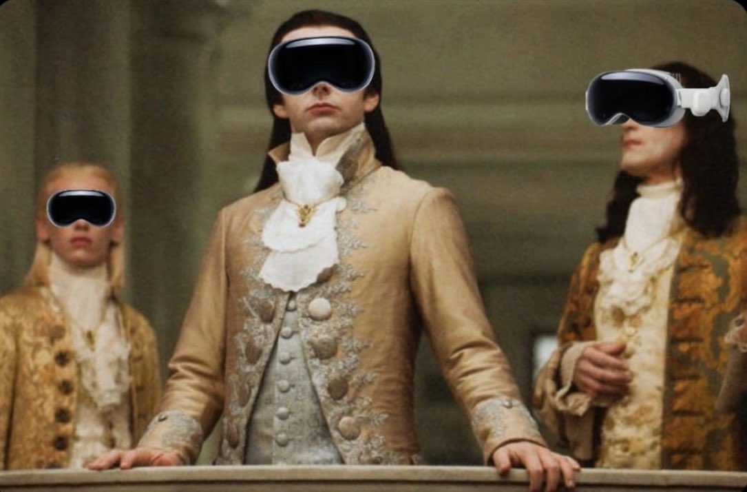 The meme is a still image from the 2006 film "The Queen" with the characters' faces replaced with VR headsets. The image is captioned "When you're trying to have a royal meeting but everyone's still on their VR headset".