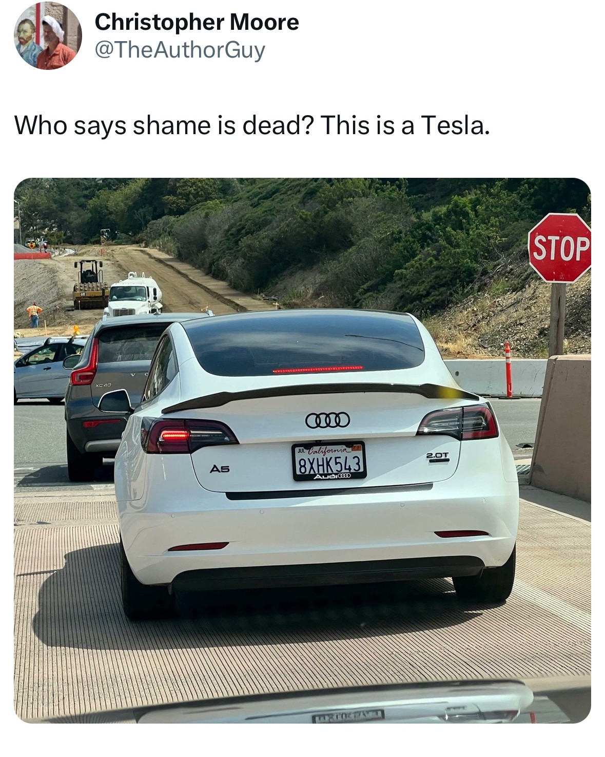 This meme is a photo of a car with a license plate that reads "8XHK543" and has a sticker that says "I BRITISH" in the style of a British license plate. The car is a Tesla, but the license plate and sticker are a joke referencing the UK's infamous "I BRITISH" license plate, which is a joke about the UK's license plates being a bit of a joke. The meme is poking fun at the idea that a Tesla, a luxury electric car, would be so cheap that it would have a "I BRITISH" license plate, implying that the car is so cheap it's worth less than a joke about a British license plate.