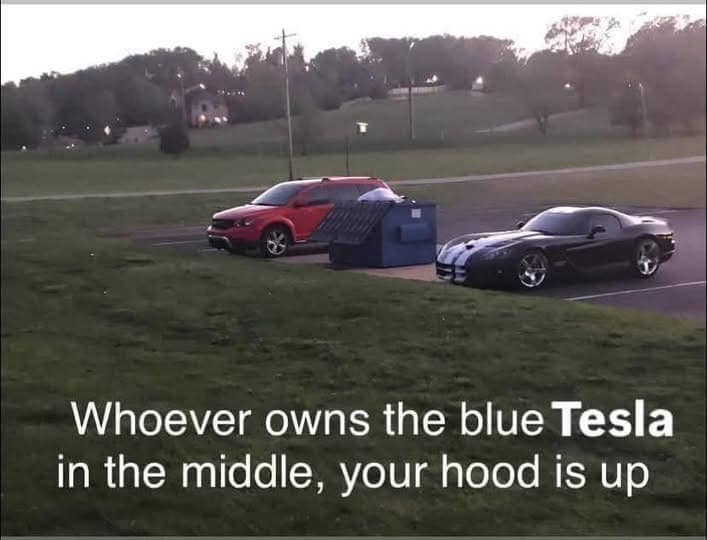 The meme is a humorous comparison of two situations: a car owner leaving their car in a no-parking zone and a Tesla owner leaving their car in a no-parking zone. The meme states "Whoever owns the blue Tesla in the middle, your car is blocking me in. Whoever owns the red car in the front, your car is blocking me in. Whoever owns the blue Tesla in the middle, your car is blocking me in. Whoever owns the red car in the front, your car is blocking me in."