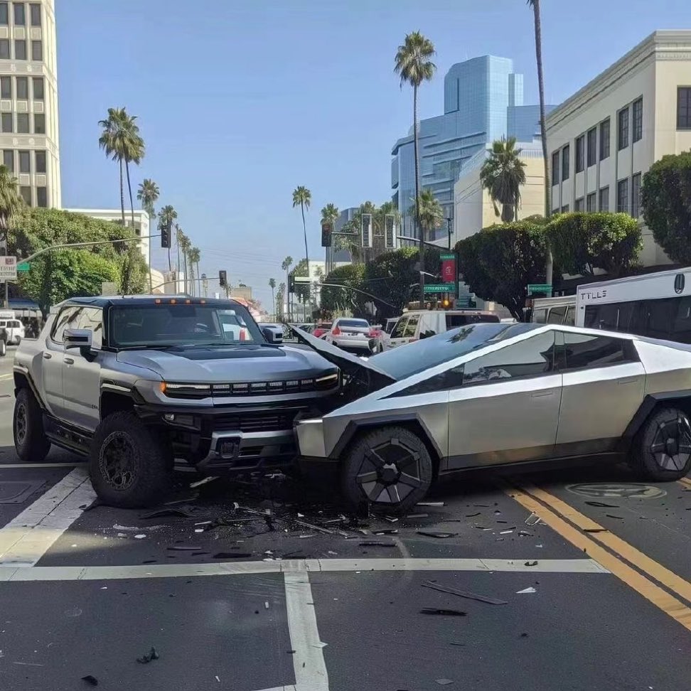 The meme is a photo of two cars, a Tesla Cybertruck and a GMC Hummer EV, smashed into each other in the middle of a road. The image is captioned "When you're trying to be the safest EV on the road, but you're actually just the safest EV in a crash".