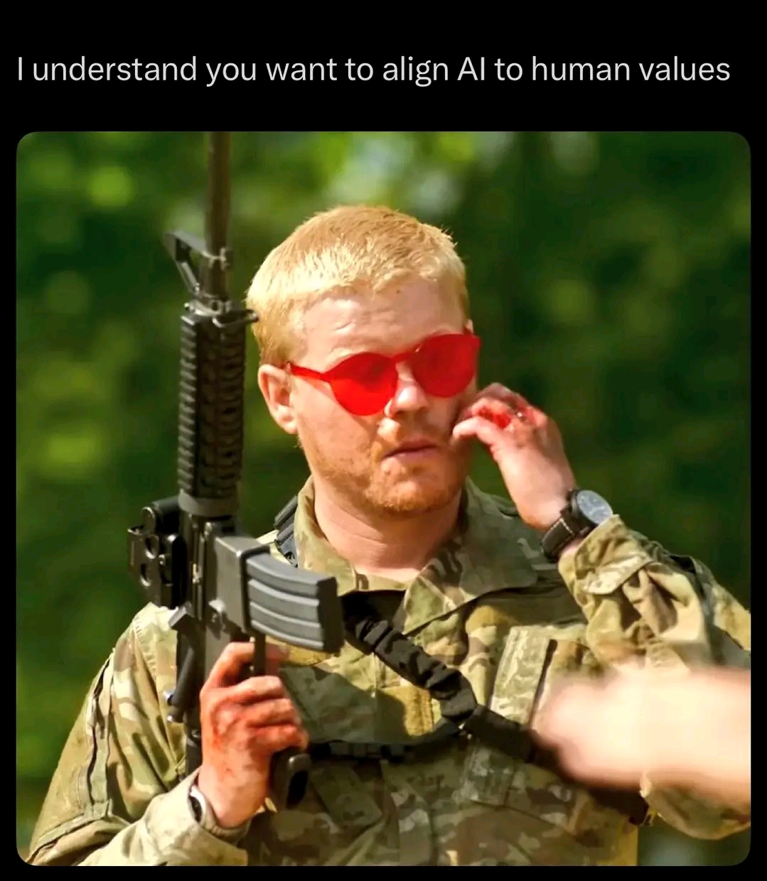The meme is a humorous image of a man in a military uniform, wearing red sunglasses and holding a rifle, with the text "I understand you want to align AI to human values" above it. The image is a satirical commentary...
