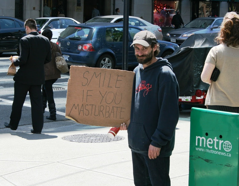 The meme is a photo of a man holding a sign that reads "SMILE IF YOU MASTURBATE". The image is likely humorous and ironic, implying that the man is asking people to smile if they have engaged in masturbation, which is a somewhat taboo topic. The sign is likely intended to be humorous and provocative, rather than serious.