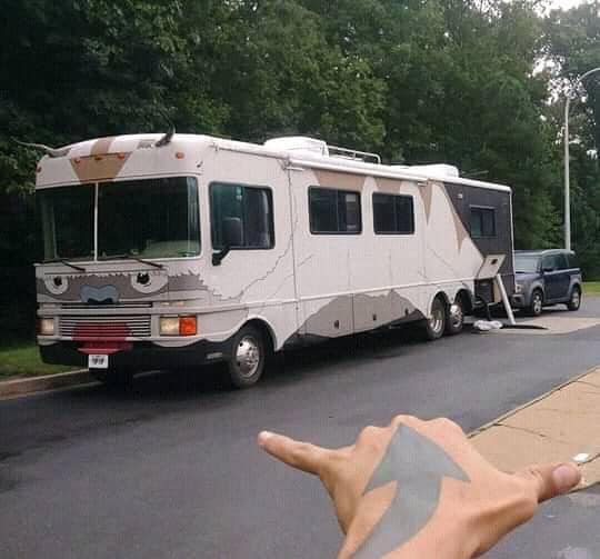 The meme is a screenshot of a photo of a bus with a broken window, but the window has been replaced with a screen showing a cat video playing on YouTube. The text "cat video" is written in the top left corner of the screen.