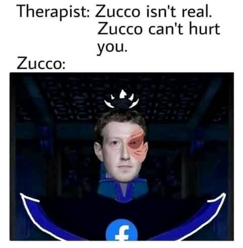 This meme is a screenshot of a character from the popular animated series "Adventure Time". The image shows the character "Jake" with a creepy expression, but his face is also distorted and has a few teeth missing. The text above the image reads "Therapist: Zucco isn't real. Zucco can't hurt you."