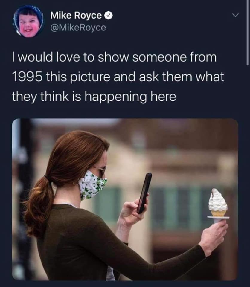 This meme is a humorous commentary on the changing nature of social media. It features a photo of a person wearing a mask, taking a photo of their ice cream cone with a smartphone. The text above the image reads, "I would love to show someone from 1995 this picture and ask them what they think is happening here."