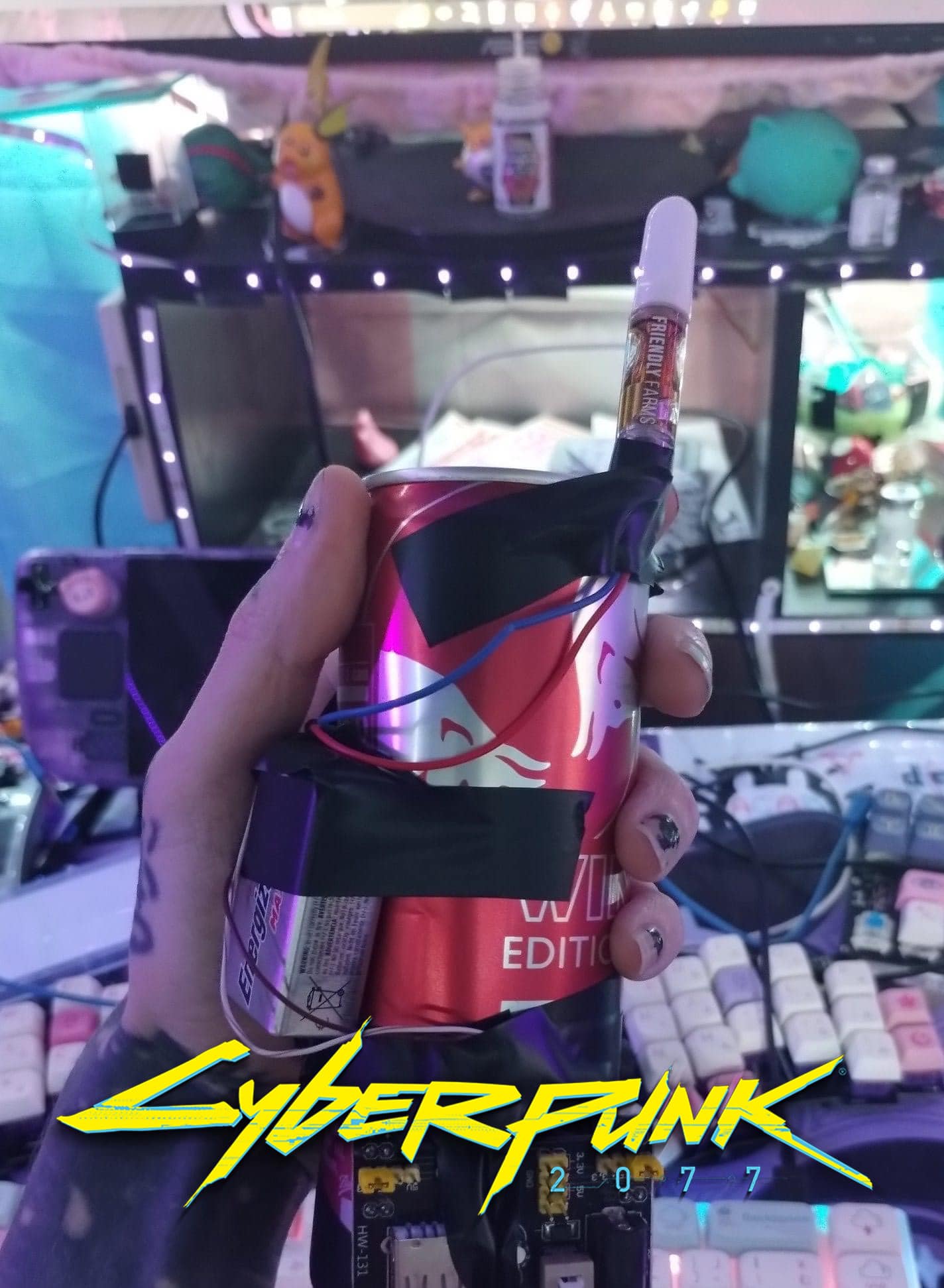 The meme is an image of a person's hand holding a can of Red Bull energy drink, with a bomb-like contraption attached to it. The image is captioned "I'm not lazy, I'm just on Red Bull time".