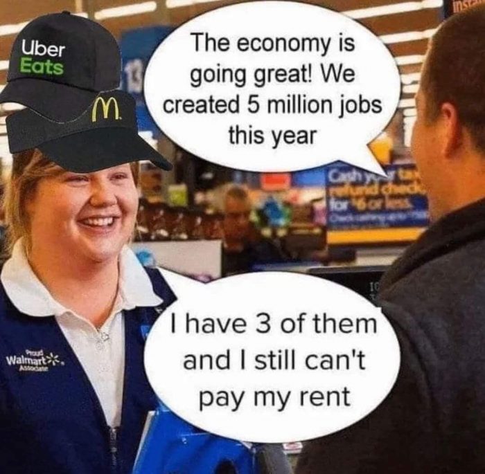 The meme is a humorous image featuring a Walmart employee interacting with a customer. The employee is wearing a Walmart vest and has a name tag that reads "I'm with stupid". The customer is holding a sign that reads "I'm not stupid". The text in the image reads: "Me: I'm with stupid. Customer: I'm not stupid. Me: Oh, okay, then you're with me."