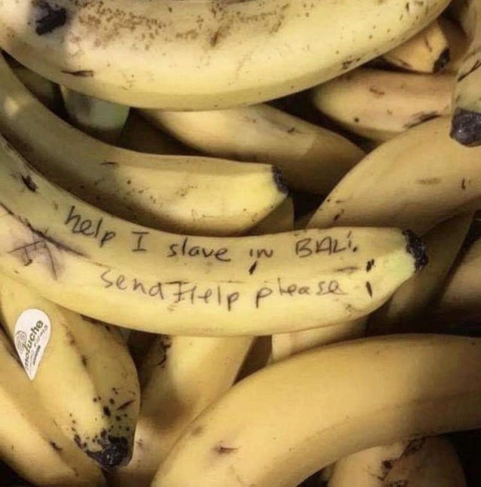 This meme is a humorous image of a banana with a handwritten note on it. The note says "help I'm a slave in a banana republic" and "help I'm trapped in a banana republic". The joke is that the banana is trying to escape from a fictional country called "Banana Republic", but the notes are actually just a desperate cry for help, as the banana is stuck in a fruit bowl and wants to be rescued.