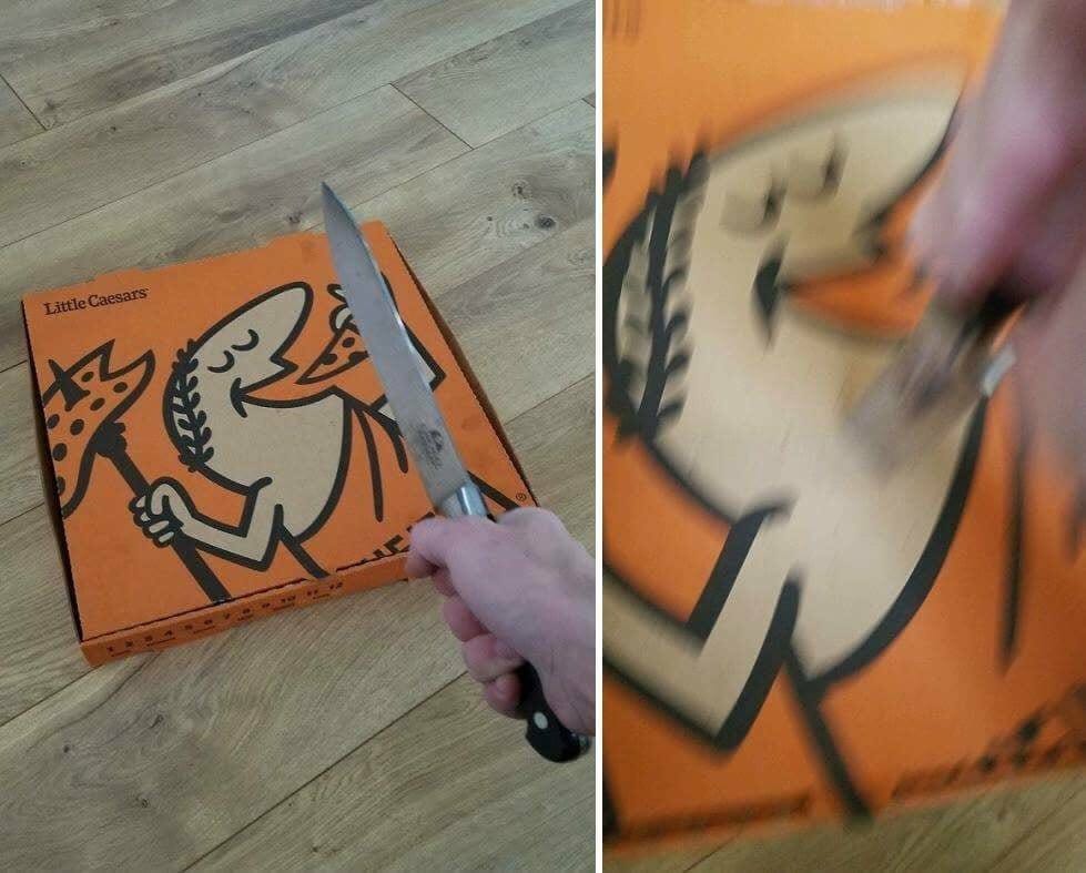 The meme is a humorous image of a pizza box with a cartoon character on it, but the character has been replaced with a crude drawing of a pizza with a knife stuck in it. The image is captioned "I ordered a pizza and it came with a side of anger". The joke is that the pizza box is now "armed" with a knife, implying that the pizza is "angry" or "armed" and ready to attack.