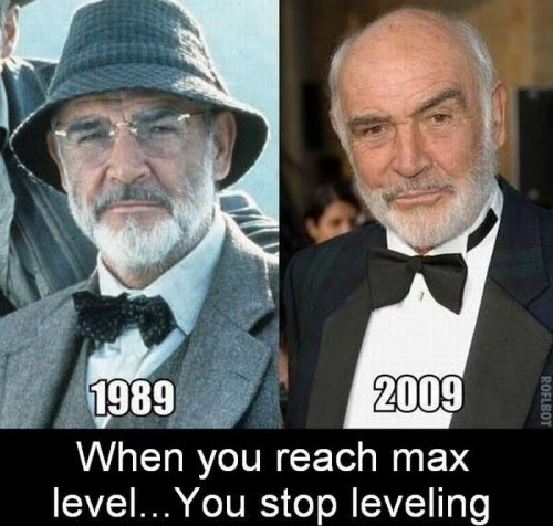 This meme is a humorous comparison between two images of actor Sean Connery, who played the character James Bond in the 1980s and 2000s. The first image shows Connery in his younger years, and the second image shows him in his later years. The text at the bottom of the meme reads, "In 1989, you were on top of the world. In 2009, you were on top of the world... and then you had a stroke. Now you're just on top of the bed."