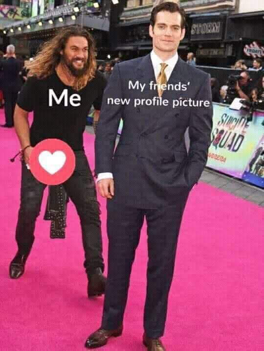 The meme is a photo of two men walking on a red carpet. One of them, played by Jason Momoa, is dressed in a black t-shirt with "Me" printed on it. The other man, played by Henry Cavill, is dressed in a formal suit, and the text "My friends' new profile picture" is written above him, implying that he is now a popular or iconic figure, and Jason Momoa is reacting with excitement or admiration.