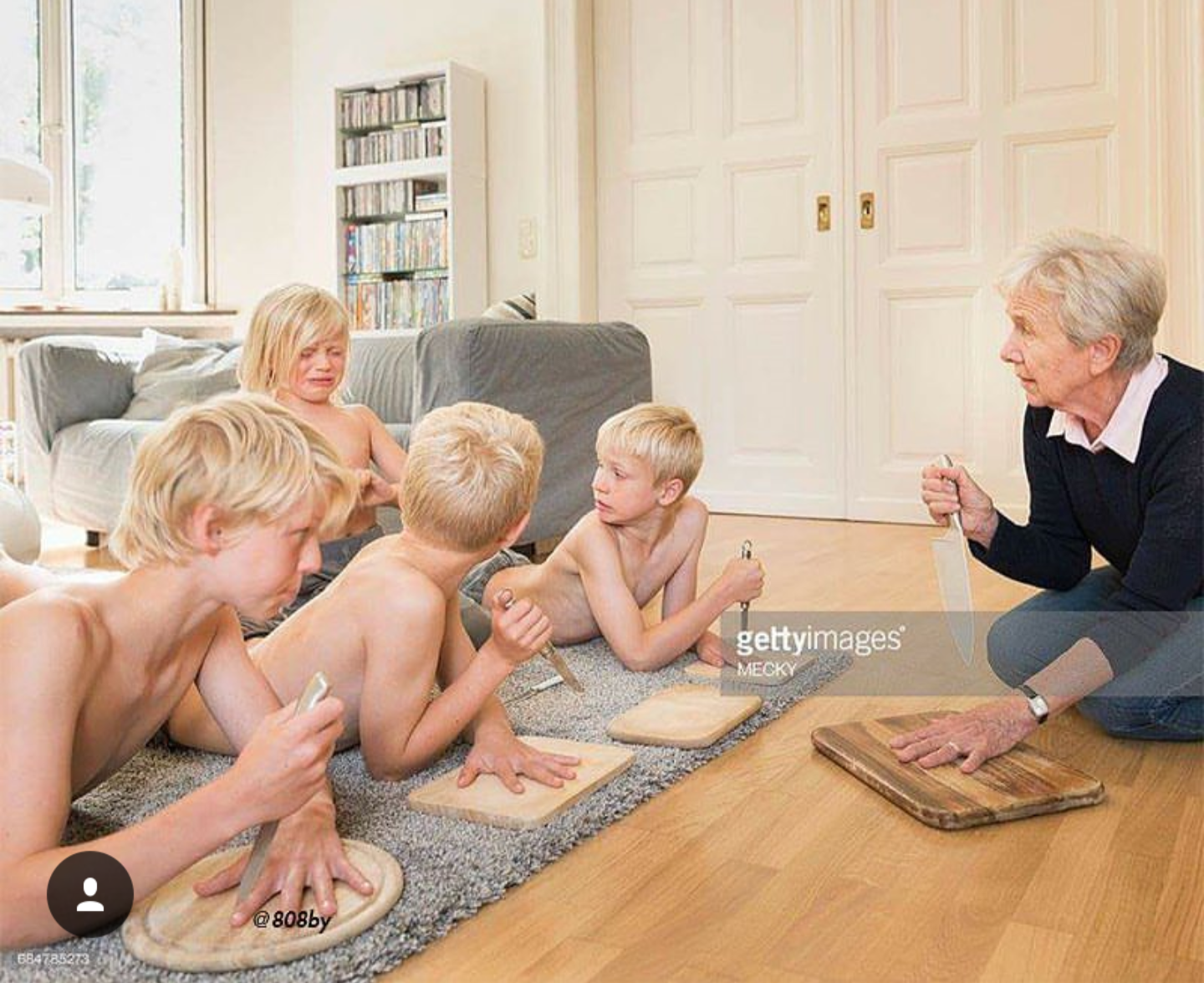 The meme is a photo of a group of children, presumably the von Trapp children from the movie "The Sound of Music", playing a game of "I Spy" with a woman who is not a nun. The text "I spy with my little eye something beginning with N" appears in the image. The meme is likely referencing the classic "I Spy" game, but with a twist, as the children are not playing the game with a traditional object, but with a knife.