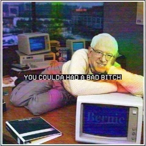 This meme is an image of a man sitting on the floor, surrounded by old computers and electronics, with a nostalgic and slightly frustrated expression. The text overlayed on the image reads "You could have had it all" and "You could have been a hero, but now you're just a zero" - a reference to the classic video game "Pac-Man".