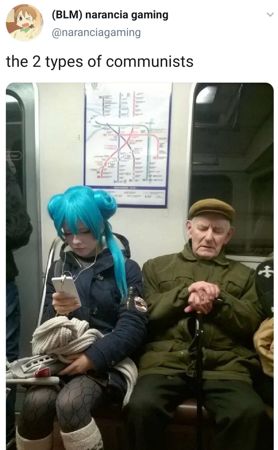 This meme is an image of two people on a train or bus. The person on the left has bright blue hair and is looking at their phone with a bored expression. The person on the right is dressed in military attire and is also looking at their phone with a similarly bored expression. The text above the image reads, "the 2 types of communists".