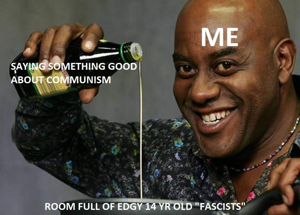 The meme features a photo of a person smiling and pouring oil into a bottle. The text "SAYING SOMETHING GOOD ABOUT COMMUNISM" is superimposed on the person's hand, while "ME" is written on their face. The image is meant to be humorous and satirical, poking fun at the idea of someone being overly enthusiastic about something.