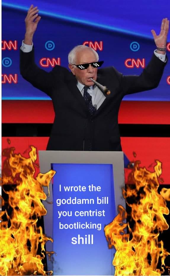 The meme features a photo of Bernie Sanders, a former US presidential candidate, standing at a podium with his arms raised in a triumphant gesture. He is wearing sunglasses and has a microphone in his mouth. The text on the podium reads: "I wrote the goddamn bill you centrist bootlicking sh*ll" (note: the text is censored in the image, but it's a quote from a speech by Bernie Sanders). The image is meant to be humorous and satirical, poking fun at the idea that a politician can be both a hero and a villain at the same time.