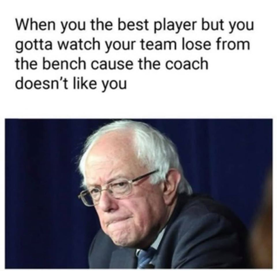 The meme is a humorous image of Bernie Sanders with a disappointed expression. The text above the image reads: "When you're the best player but you gotta watch your team lose from the bench because the coach doesn't like you." The image is meant to poke fun at the frustration of being a talented player who is not given the opportunity to play due to a coach's personal preference.