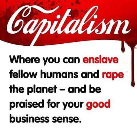 The meme is a humorous critique of the concept of capitalism. It features the word "Capitalism" in a blood-red, dripping font, followed by a tongue-in-cheek definition that suggests it's a system where you can enslave, rape, and be praised for your business sense. The text is written in a bold, dark font, with the words "enslave", "rape", and "praise" highlighted in red.
