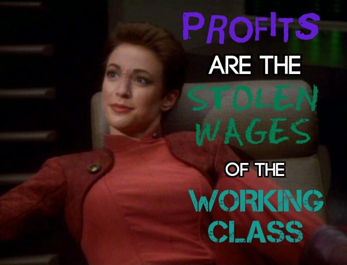 The meme is a still image from the TV show Star Trek: The Next Generation, featuring a character (Deanna Troo...), but the image is not described here. The text overlayed on the image reads: "Profits are the Stolen Wages of the Working Class."