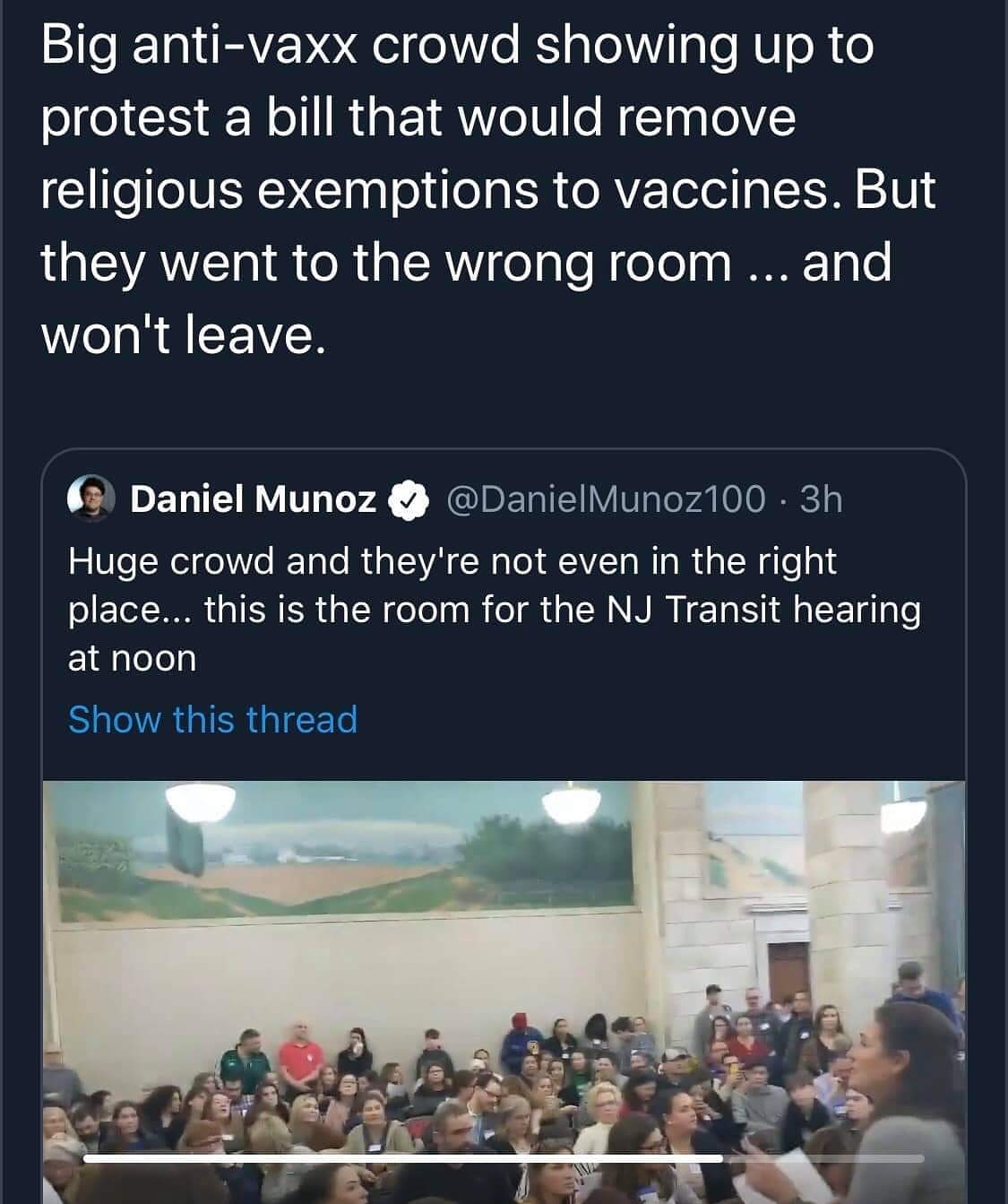 The meme is a screenshot of a Twitter post that comments on a large group of anti-vaxxers (people who oppose vaccination) who are protesting a bill to remove religious exemptions to vaccines. The post describes the situation as "a huge crowd" that is "not even in the right place" and is "not even in the right place" to be in the right place. The text includes a quote from the post, which says "this is the room for the NJ Transit hearing at noon".