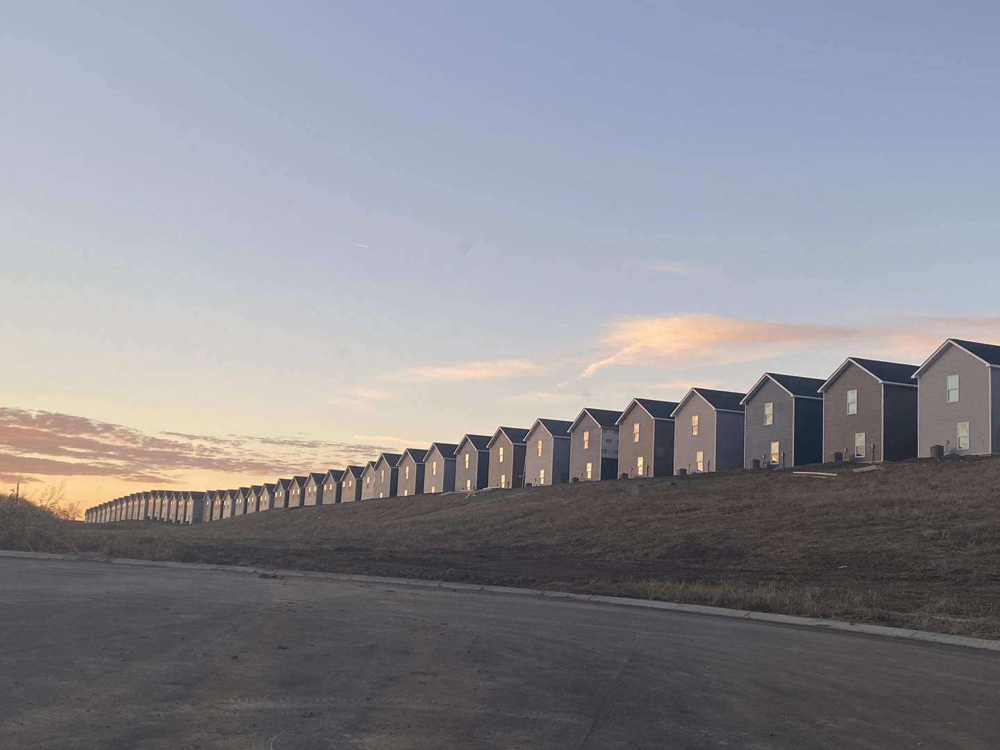 The meme is an image of a long row of identical houses, each with a single light on in every window. The text that appears in the image is "I'm not arguing, I'm just explaining why I'm right".