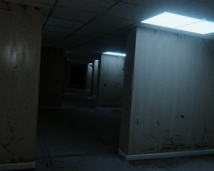 The meme is a picture of a dark, abandoned hallway with a faint glow emanating from the lights in the distance. The image is captioned "I'm not scared of the dark...".