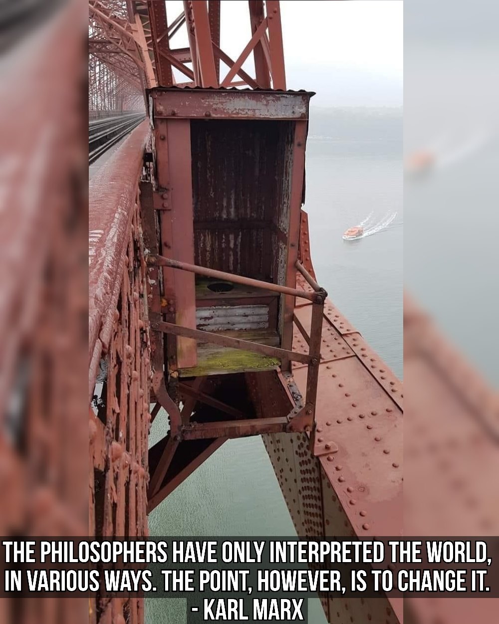 This meme is a humorous image of a small, rusty, and old-looking elevator car that appears to be stuck in the middle of a large, industrial-looking bridge. The text overlayed on the image reads: "The philosophers have only interpreted the world, in various ways. The point, however, is to change it."